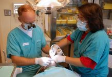 Two dentists performing a wisdom teeth removal procedure in Mulgrave