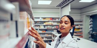 Young woman working in a compounding pharmacy in Melbourne