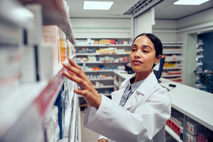 Young woman working in a compounding pharmacy in Melbourne